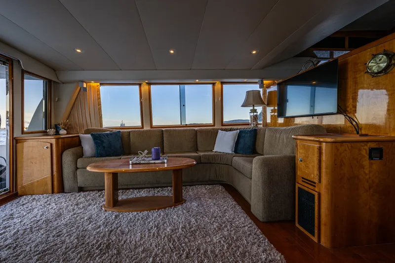 Slide: The Image of Luxurious interior of 2001 Navigator 61' Pilothouse yacht with plush seating and elegant decor. - 33