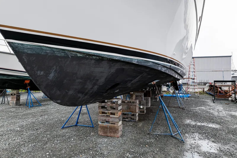 Slide: The Image of 2001 Navigator 61' Pilothouse yacht on stands in a boatyard. - 44