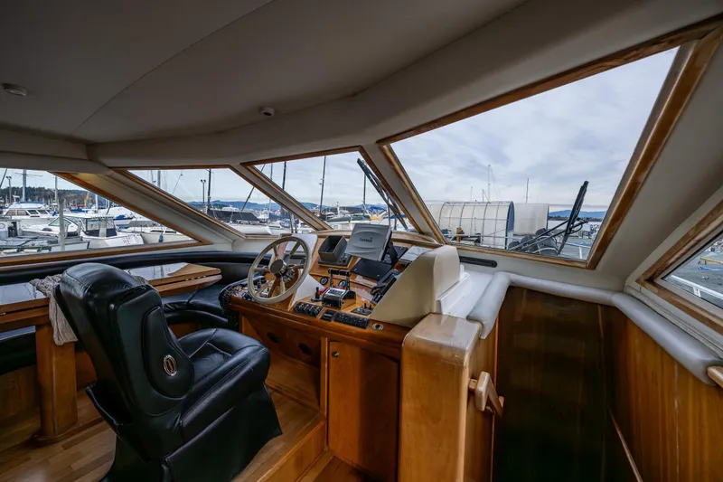 Slide: The Image of Interior of 2001 Navigator Pilothouse yacht with steering wheel and panoramic windows. - 10