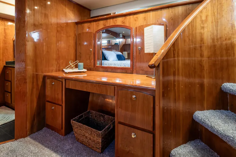 Slide: The Image of Luxurious 2001 Navigator Pilothouse interior with wooden cabinetry and carpeted stairs. - 17
