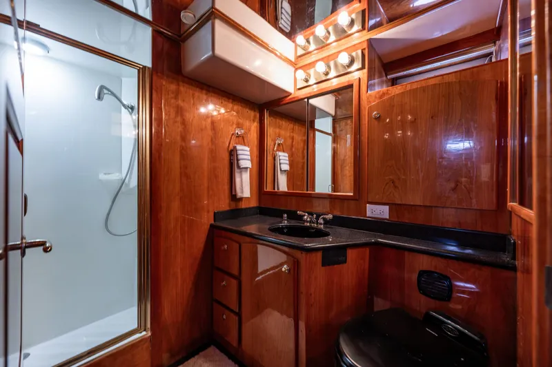 Slide: The Image of Luxurious 2001 Navigator Pilothouse bathroom with wood paneling and modern fixtures. - 19