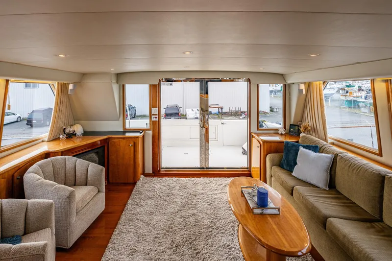 Slide: The Image of Luxurious 2001 Navigator Pilothouse yacht interior with plush seating and elegant wood finishes. - 3