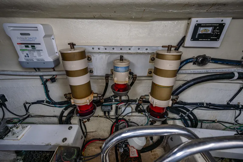 Slide: The Image of Engine room of 2001 Navigator Pilothouse with fuel filters and control panels. - 43