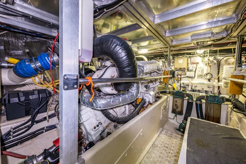 Slide: The Image of Engine room of a 2001 Navigator Pilothouse yacht, showcasing machinery and equipment. - 46