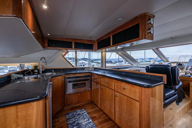 Slide: The Image of Luxurious 2001 Navigator Pilothouse yacht interior with modern kitchen and panoramic windows. - 8