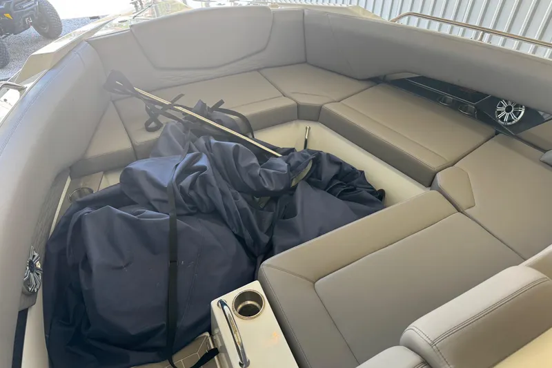 Slide: The Image of 2021 Cruisers Yachts 338 South Beach Edition Bow Rider interior with seating and cover. - 10