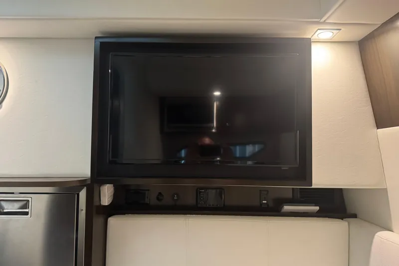 Slide: The Image of Interior of 2021 Cruisers Yachts 338 South Beach Edition with mounted TV and modern design. - 22