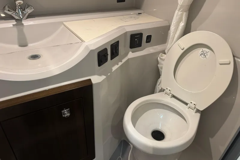 Slide: The Image of 2021 Cruisers Yachts 338 South Beach Edition bathroom with sink and toilet. - 24