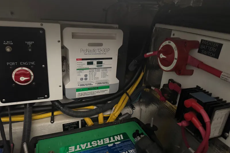 Slide: The Image of Electrical components in a 2021 Cruisers Yachts 338 South Beach Edition Bow Rider. - 27