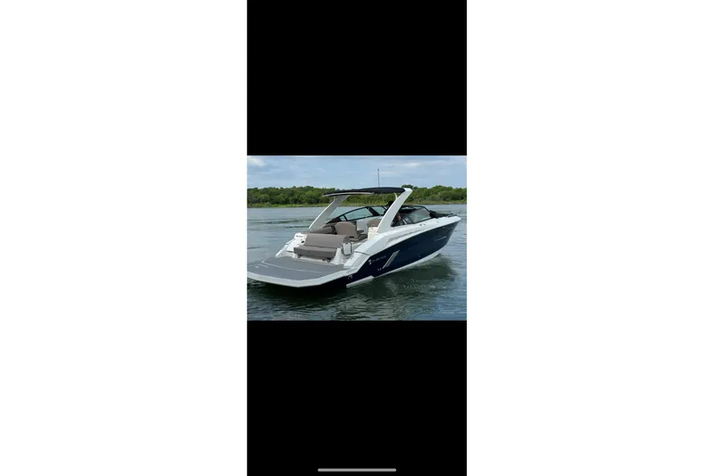 Slide: The Image of 2021 Cruisers Yachts 338 South Beach Edition Bow Rider on calm water. - 3