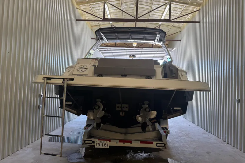 Slide: The Image of 2021 Cruisers Yachts 338 South Beach Edition Bow Rider in storage facility. - 4