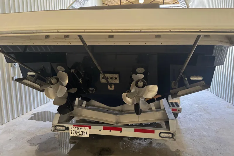 Slide: The Image of 2021 Cruisers Yachts 338 South Beach Edition Bow Rider, rear view in storage. - 5