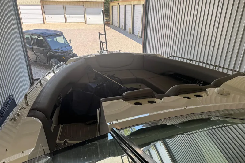 Slide: The Image of 2021 Cruisers Yachts 338 South Beach Edition Bow Rider in storage facility. - 9