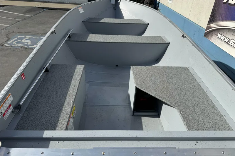 Slide: The Image of 2026 Lund WC-14 boat interior with seating and storage compartments. - 5