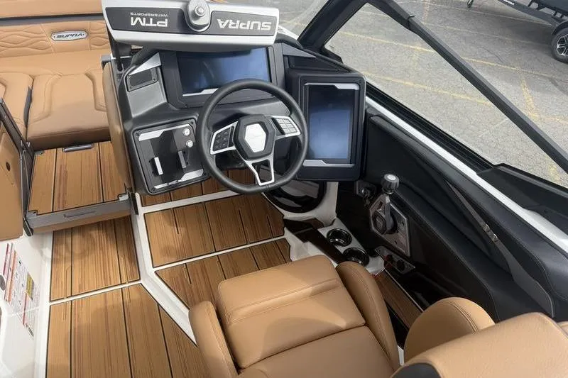 Slide: The Image of 2025 Supra SE 575 boat interior with modern dashboard and luxurious seating. - 8