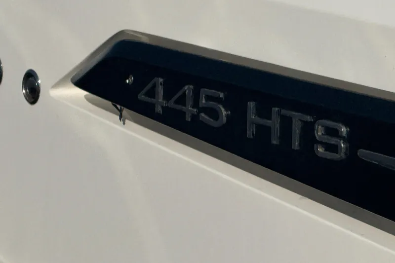 Slide: The Image of Close-up of 2017 Galeon 445 HTS yacht model nameplate on white surface. - 14