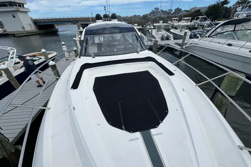 Slide: The Image of 2017 Galeon 445 HTS yacht docked at marina, showcasing sleek design and spacious deck. - 16