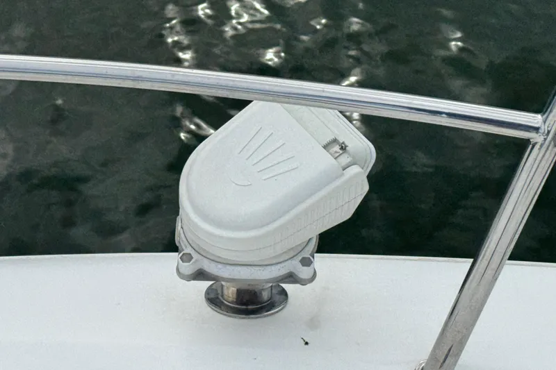 Slide: The Image of Close-up of a 2017 Galeon 445 HTS boat component by the water. - 21