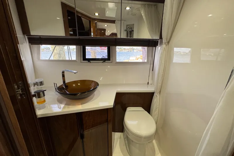 Slide: The Image of Luxurious bathroom in 2017 Galeon 445 HTS yacht with modern fixtures and scenic window view. - 29