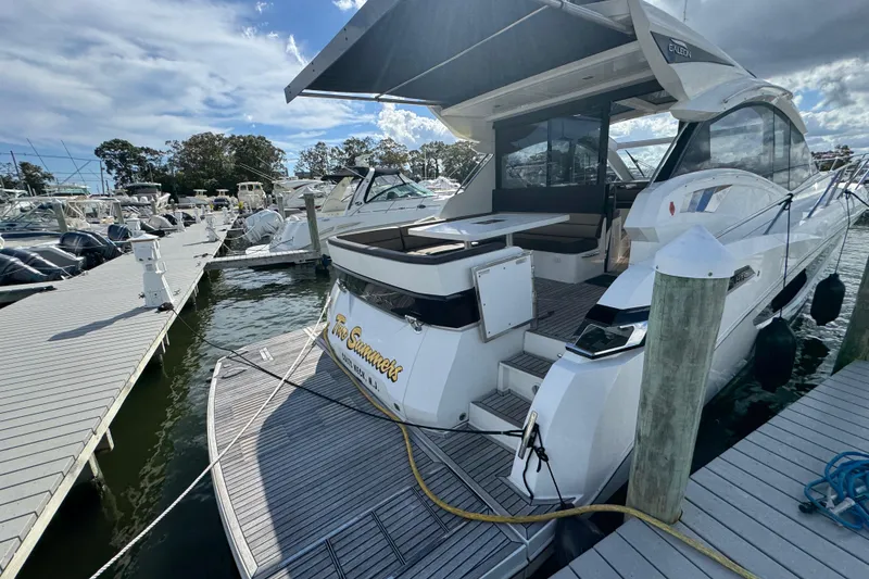Slide: The Image of 2017 Galeon 445 HTS yacht docked at marina under cloudy sky. - 33