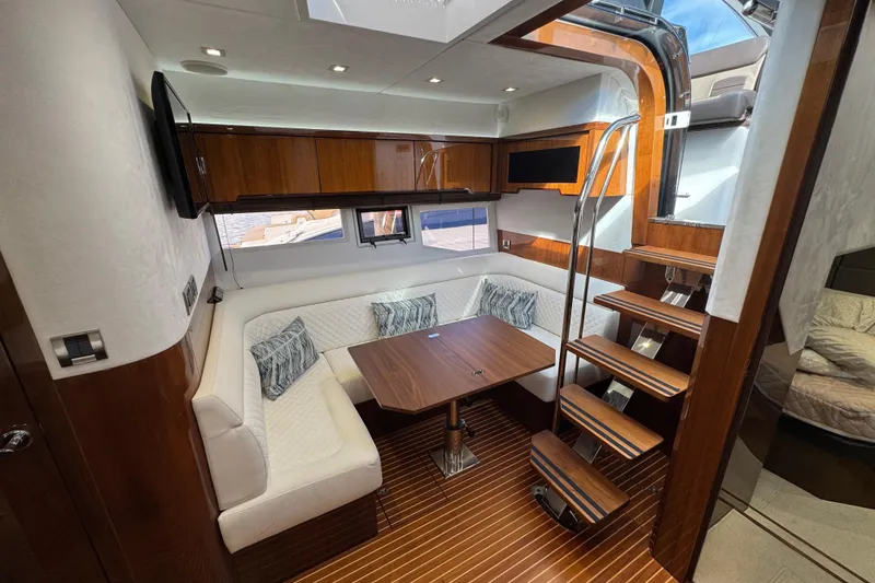 Slide: The Image of Luxurious interior of 2017 Galeon 445 HTS yacht with elegant wood finishes and cozy seating. - 36