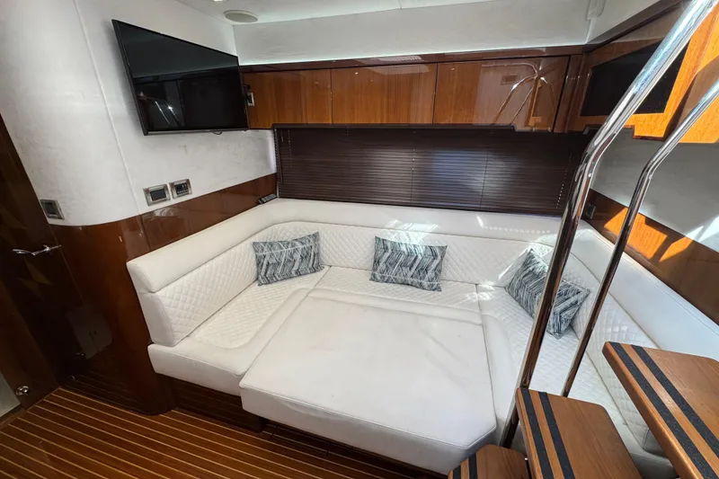 Slide: The Image of Luxurious interior of 2017 Galeon 445 HTS yacht with white seating and wooden accents. - 38