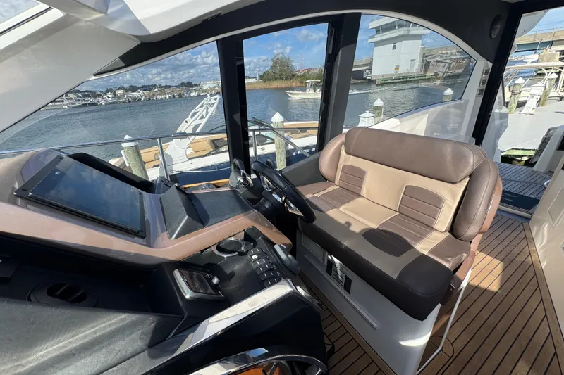 Slide: The Image of 2017 Galeon 445 HTS yacht cockpit with modern controls and comfortable seating. - 52