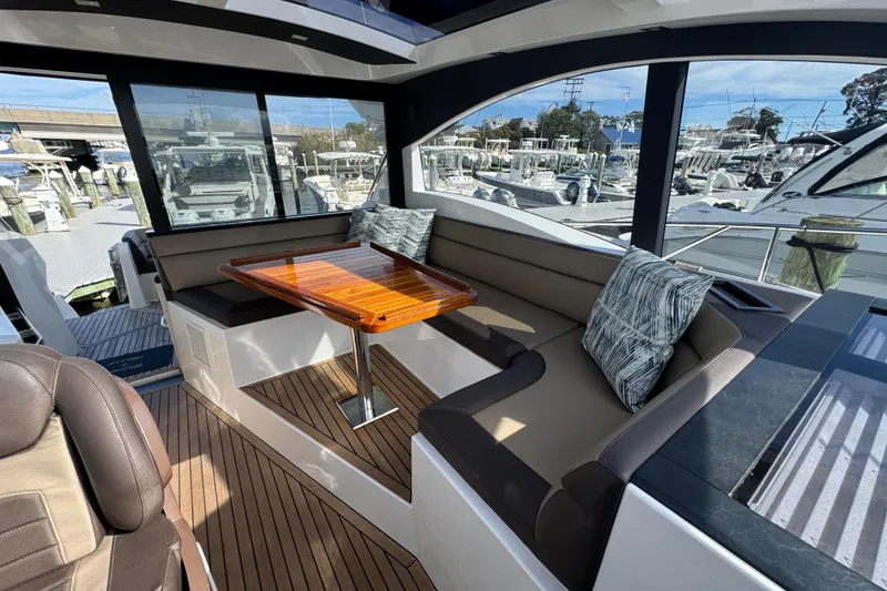 Slide: The Image of Luxurious interior of 2017 Galeon 445 HTS yacht with elegant seating and wooden table. - 53
