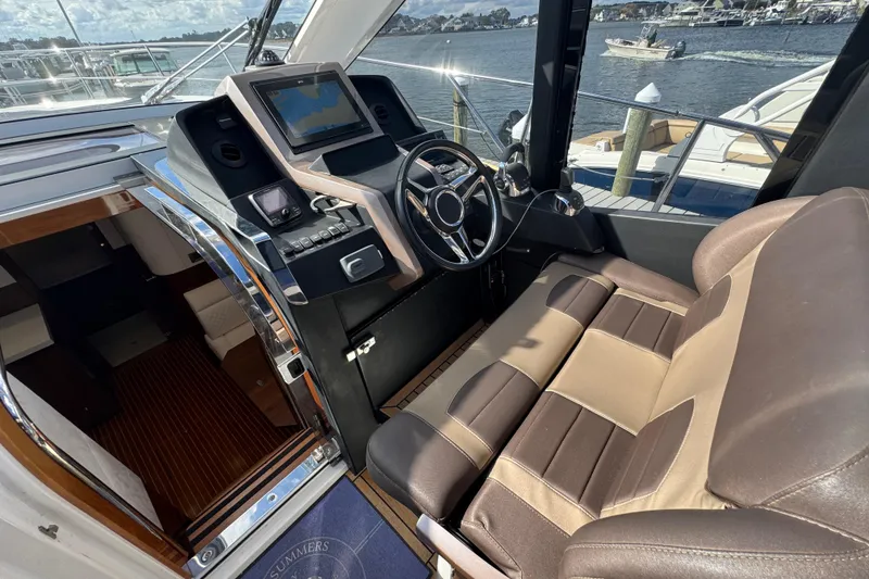 Slide: The Image of 2017 Galeon 445 HTS yacht cockpit with modern steering and navigation system. - 54