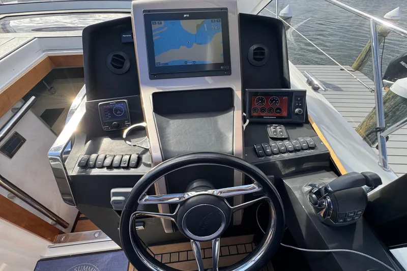 Slide: The Image of Helm of 2017 Galeon 445 HTS yacht with navigation screens and controls. - 55