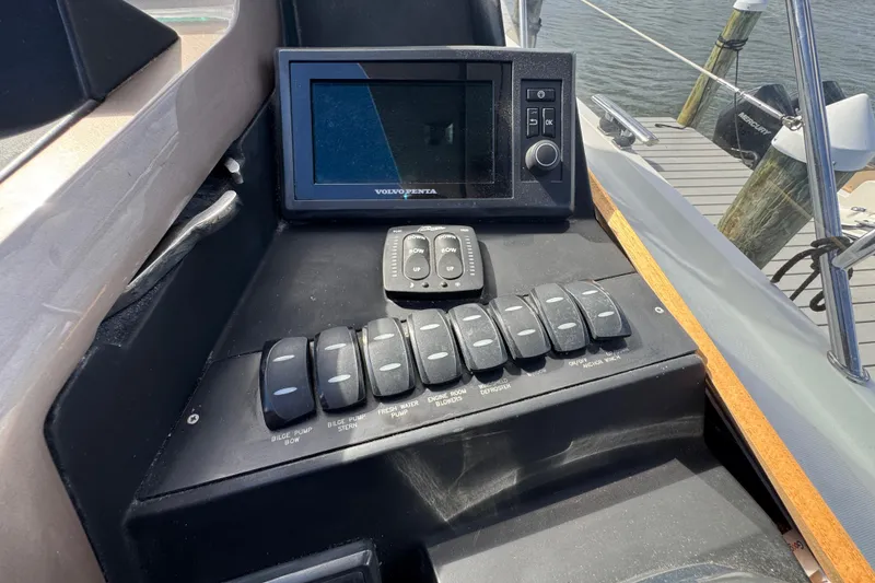 Slide: The Image of Control panel of a 2017 Galeon 445 HTS yacht with switches and a display. - 57
