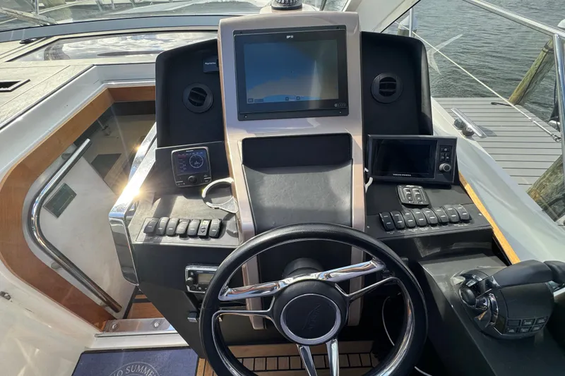 Slide: The Image of Helm of 2017 Galeon 445 HTS yacht with modern navigation equipment and steering wheel. - 60