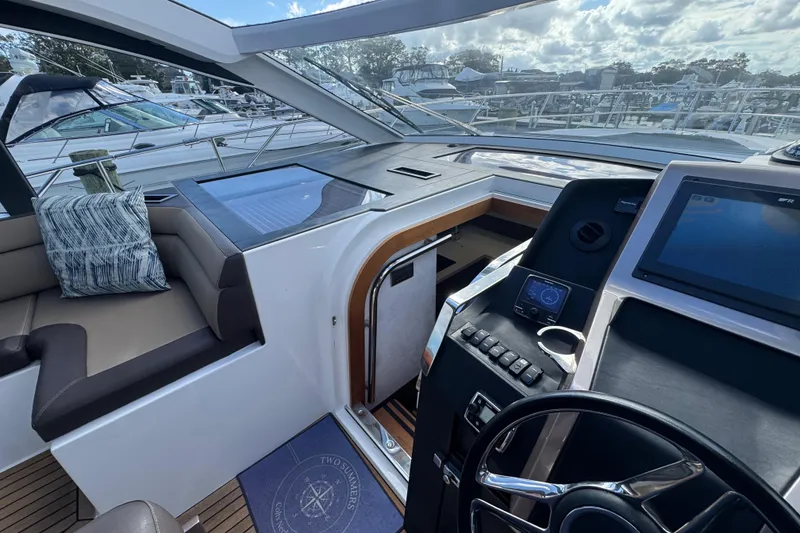 Slide: The Image of Interior view of 2017 Galeon 445 HTS yacht cockpit with modern controls and seating. - 61