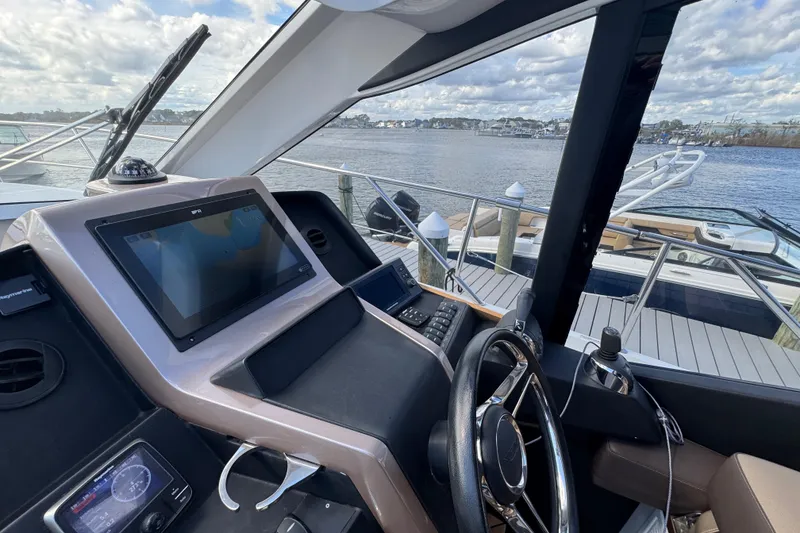 Slide: The Image of Cockpit view of 2017 Galeon 445 HTS yacht with navigation system and steering wheel. - 62