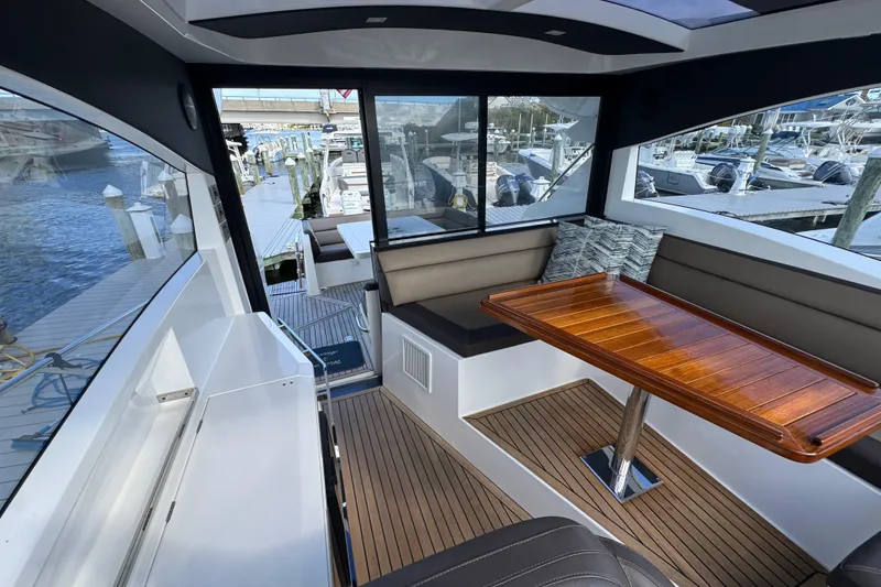 Slide: The Image of Interior of 2017 Galeon 445 HTS yacht with wooden table and seating area. - 67