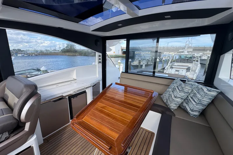 Slide: The Image of Luxurious interior of 2017 Galeon 445 HTS yacht with elegant seating and wooden table. - 68