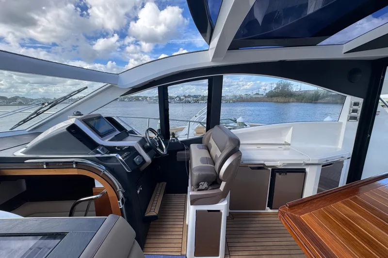 Slide: The Image of Interior view of 2017 Galeon 445 HTS yacht with modern helm and seating. - 69