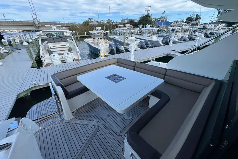 Slide: The Image of Luxury 2017 Galeon 445 HTS yacht docked, featuring spacious outdoor seating area. - 72