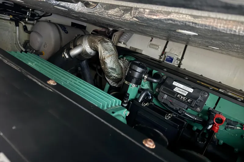 Slide: The Image of Engine compartment of 2017 Galeon 445 HTS yacht, showcasing mechanical components and wiring. - 79