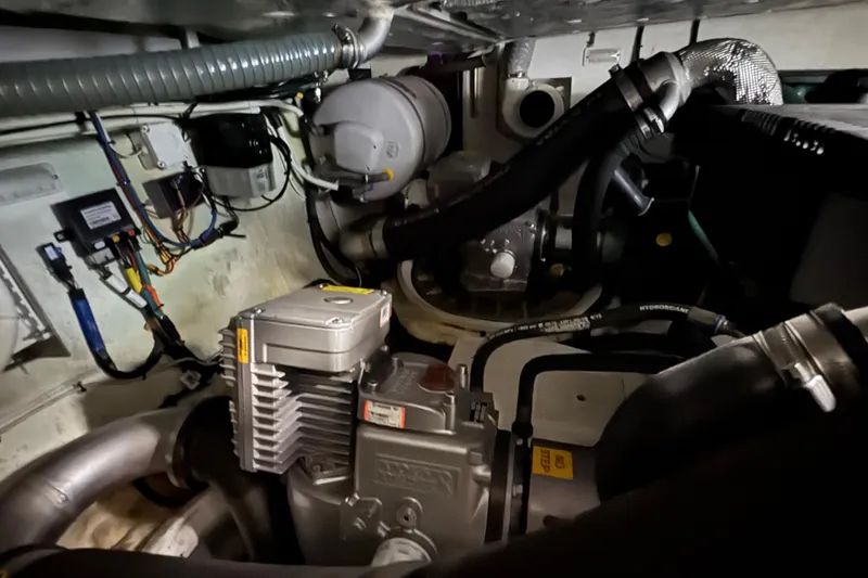 Slide: The Image of Engine room of 2017 Galeon 445 HTS yacht, showcasing mechanical components and wiring. - 80