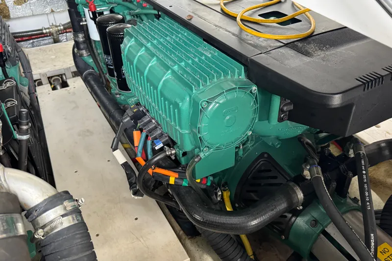 Slide: The Image of Engine compartment of a 2017 Galeon 445 HTS yacht, showcasing detailed mechanical components. - 84