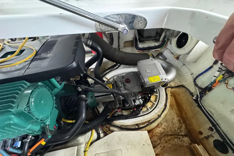 Slide: The Image of Engine compartment of a 2017 Galeon 445 HTS yacht, showcasing mechanical components and wiring. - 87