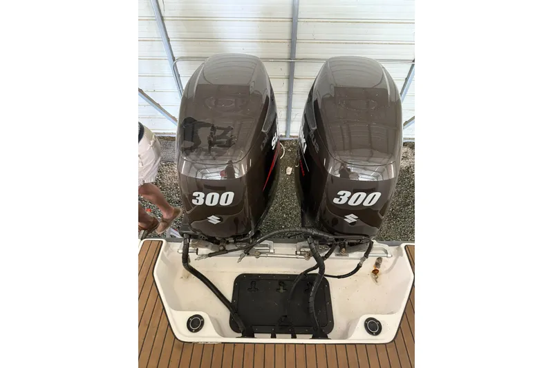 Slide: The Image of Twin 300 horsepower Suzuki outboard engines on a 2000 Boston Whaler 28 Outrage boat. - 10
