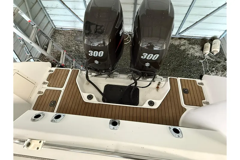 Slide: The Image of Boston Whaler 28 Outrage 2000 with twin Suzuki 300 engines, teak deck detail. - 12