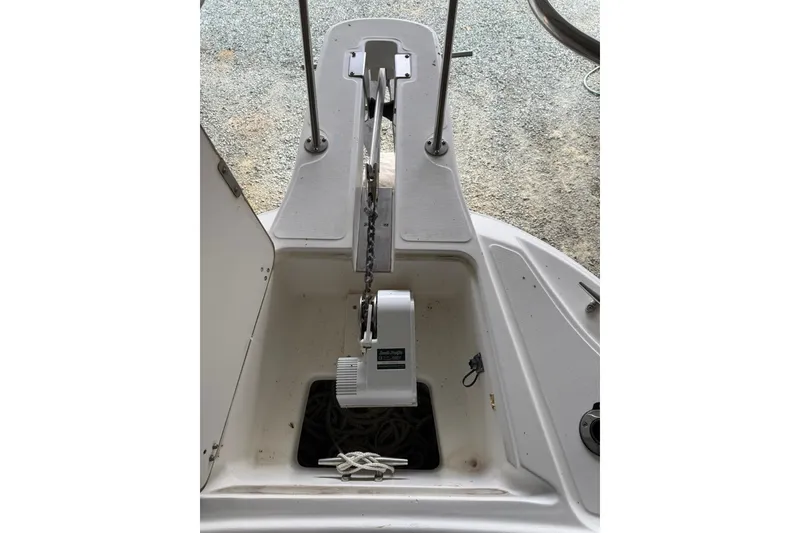 Slide: The Image of Boston Whaler 28 Outrage 2000 anchor compartment with chain and winch system. - 24