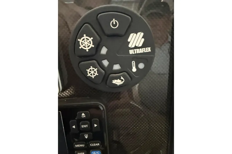 Slide: The Image of Control panel of a 2000 Boston Whaler 28 Outrage boat with Ultraflex buttons. - 29