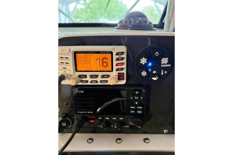 Slide: The Image of Control panel of a 2000 Boston Whaler 28 Outrage with GPS and radio equipment. - 32