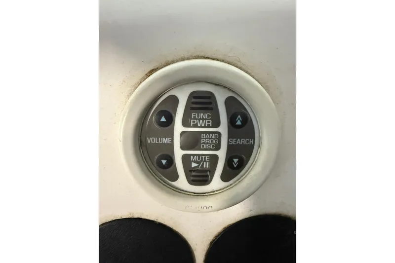 Slide: The Image of Control panel on a 2000 Boston Whaler 28 Outrage boat, featuring volume and search buttons. - 37