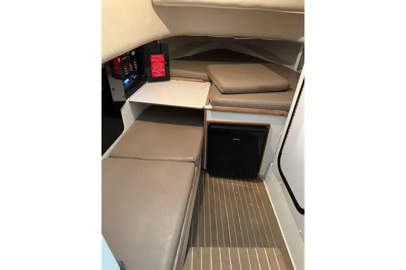 Slide: The Image of Interior cabin of 2000 Boston Whaler 28 Outrage with cushioned seating and compact design. - 40