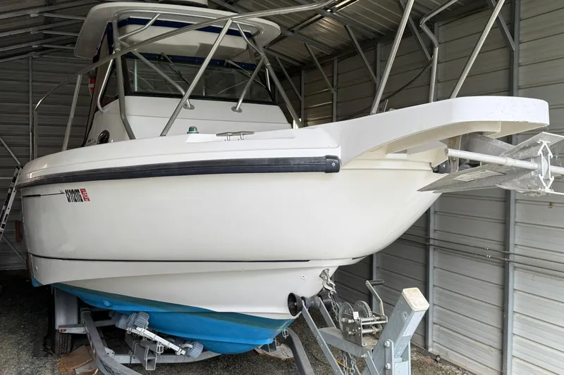 Slide: The Image of 2000 Boston Whaler 28 Outrage boat in storage, front view, on trailer. - 5